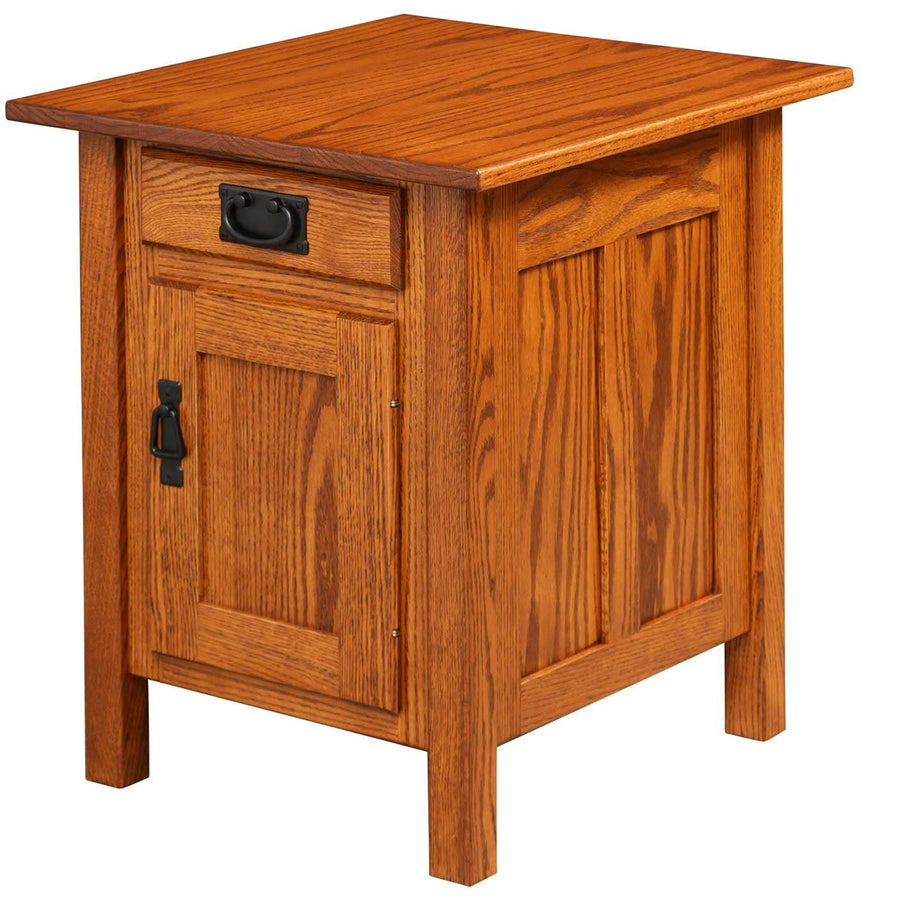 Oak Mission end table with one drawer, a paneled door with black hardware and paneled side panels