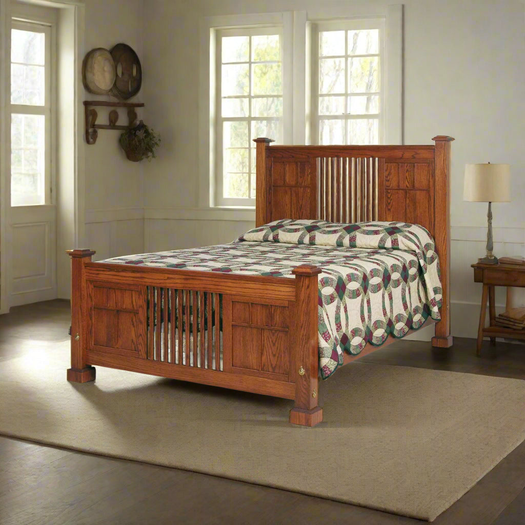 Mission style oak panel bed with vertical slat head and footboard and a wedding ring quilt