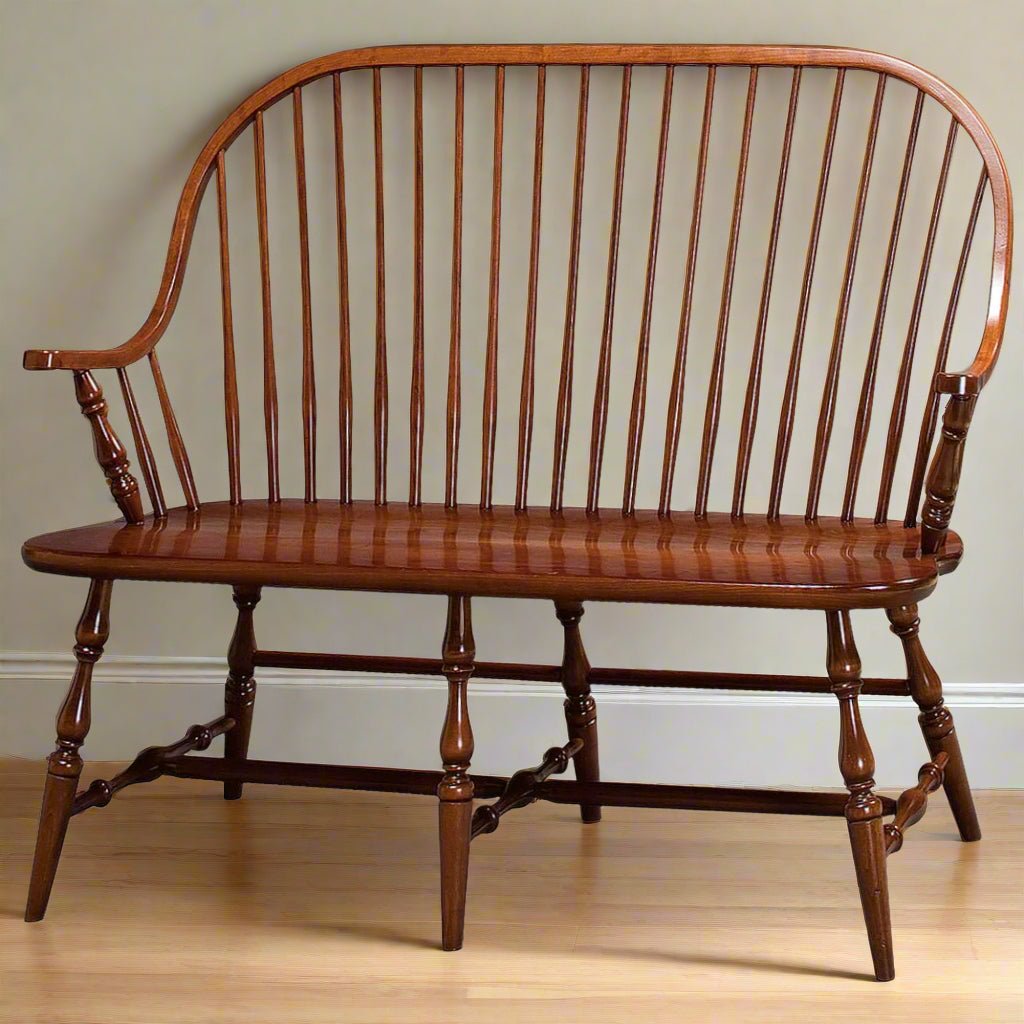 Windsor settee bench for two in cherry with a continuous arm bow, spindle back and eight turned legs