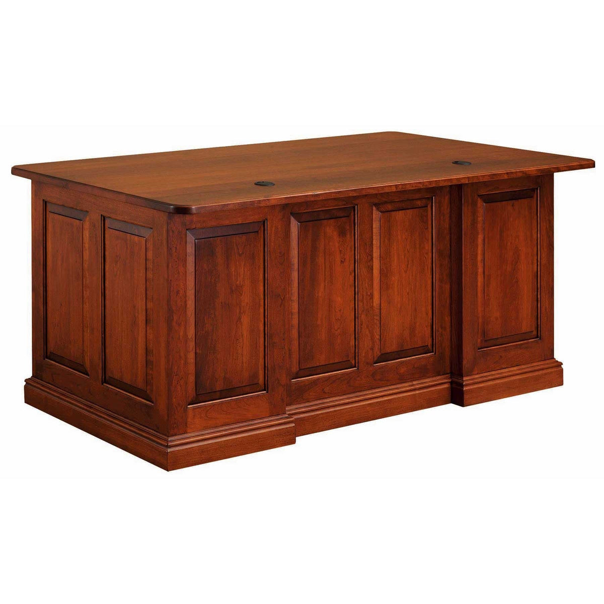 Cherry panel desk in a sunlit office with a corner hutch unit, desk lamp and leather chair behind