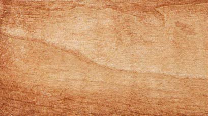 Harvest stain on maple wood sample showing a light tan finish with soft peach undertone and grain