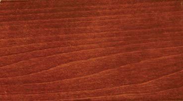 Washington Cherry stain on maple, a bright reddish brown sample with wavy fine grain lines