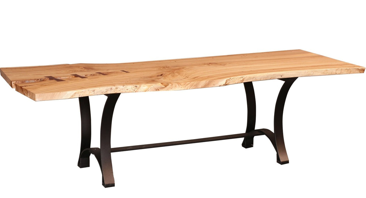 Live edge maple dining table on curved black steel legs joined by a straight cross stretcher