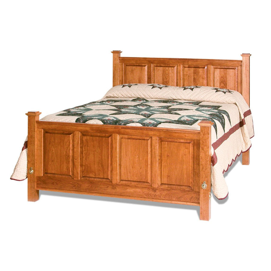 Cherry raised panel bed with squared posts, four panel head and footboard and a floral quilt