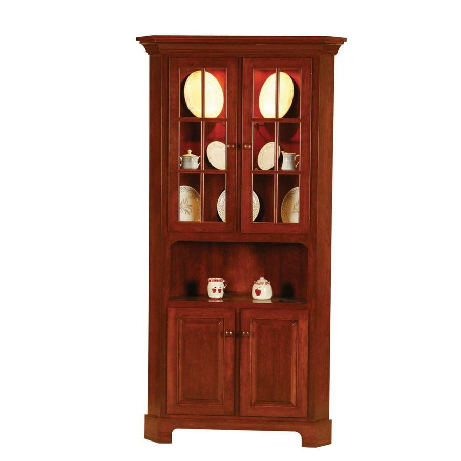 Cherry corner china cabinet with two glass paned doors over a red lined interior, an open shelf and two lower raised panel doors