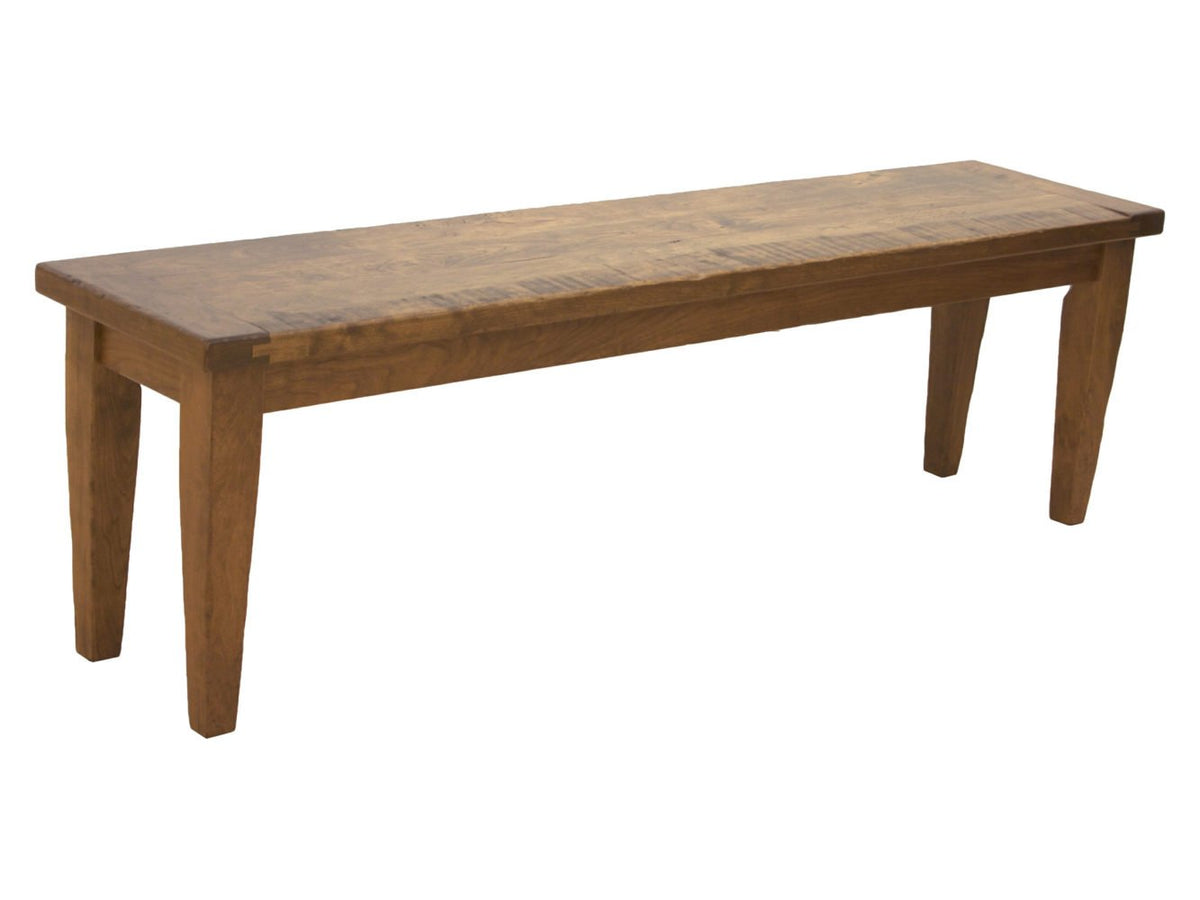Rustic dining bench with a distressed plank top, tapered legs and light brown finish on a white background
