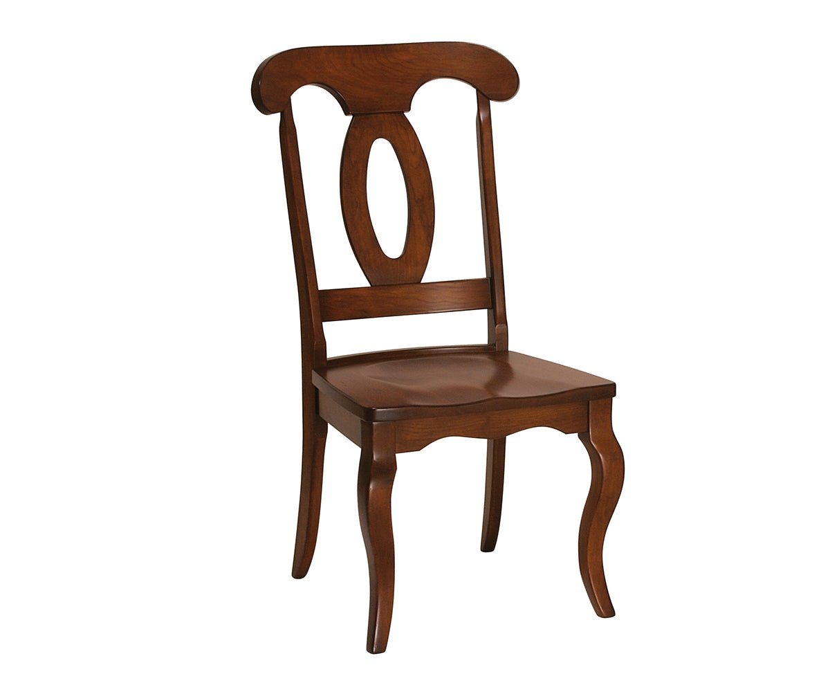 Cherry side dining chair with oval pierced back splat, shaped crest rail, curved legs and saddle seat