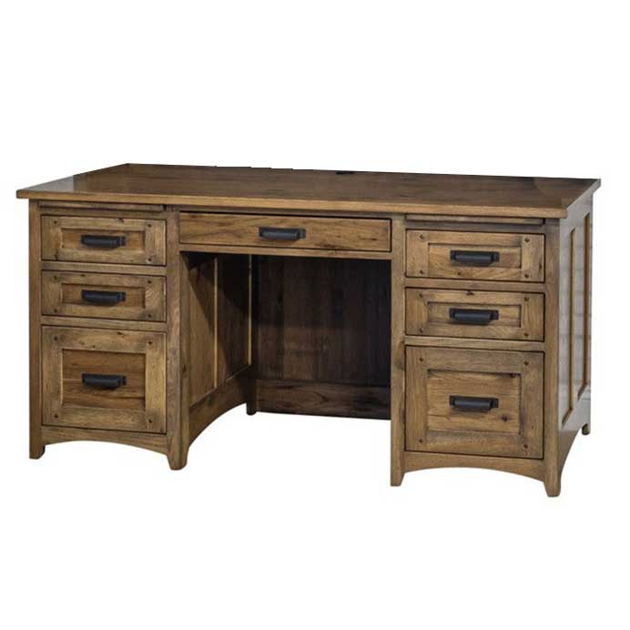 Angled view of a rustic wood executive desk with six drawers, center pencil drawer and dark bronze handles