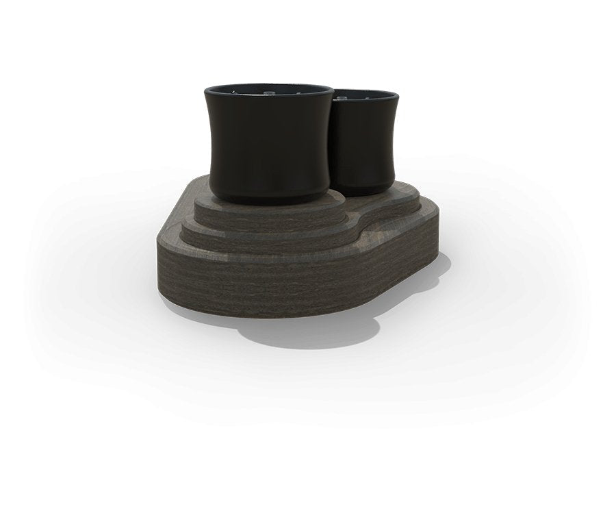 Angled view of the tabletop fire bowl set showing two matte black burners on a tiered gray poly base