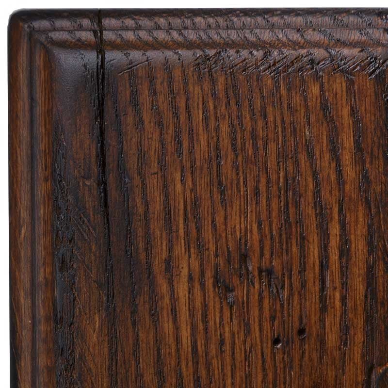 Asbury antiqued rustic oak swatch, glossy chestnut brown finish with strong grain lines, a check and chisel distress marks