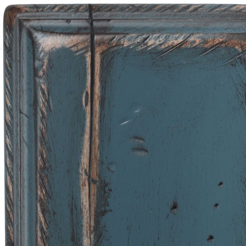 Royal Blue antiqued maple swatch corner, rich blue paint worn to bare wood along the molding with punched distress holes