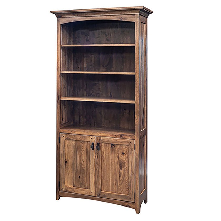 Tall hickory bookcase with arched crown, four adjustable shelves and two paneled lower doors on white
