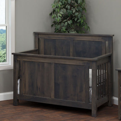 Weathered gray Bloomington crib with flat raised panel ends and slatted sides in a bright corner nursery