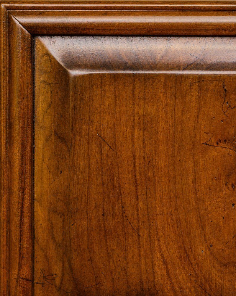 Brazil Renaissance stain sample showing a golden amber cherry panel with beveled edge and fine distressing