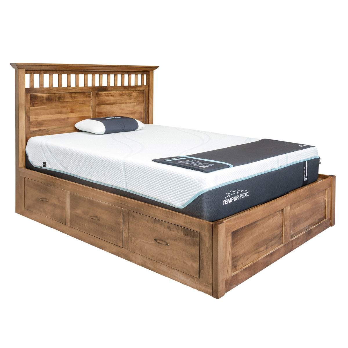 Rustic storage bed with a slatted and paneled headboard, three drawers along the base and a foam mattress