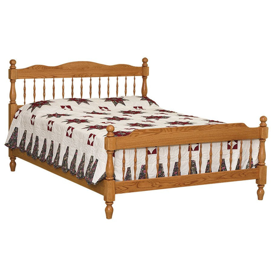 Oak spindle bed with turned posts, ball finials and rows of turned spindles, made up with a star quilt