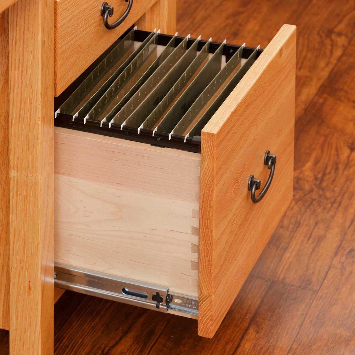 Deep file drawer opened on the student desk pedestal, fitted with hanging folder bars and dovetailed sides