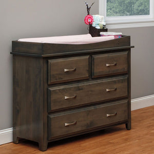 Gray stained Amish changing dresser with removable changing tray top, two small over two wide drawers, set beside a nursery window