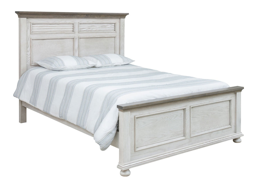 Angled view of the white panel bed with gray top caps, molded panel footboard and bun feet