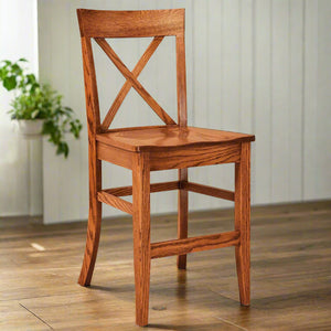 Oak X back bar chair with a curved crest rail, contoured wood seat, footrest stretchers and tapered legs