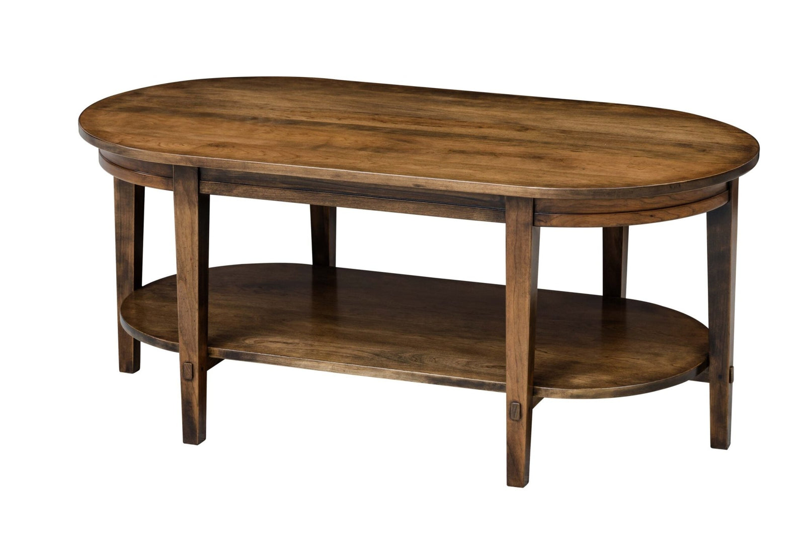 Oval coffee table with a lower display shelf and tapered legs styled in a living room beside a brown chenille sofa