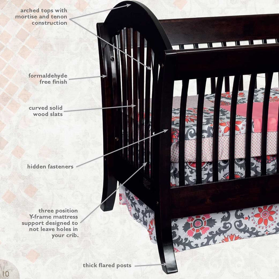 Callout diagram of the espresso sleigh crib noting arched tops, curved solid wood slats and thick flared posts