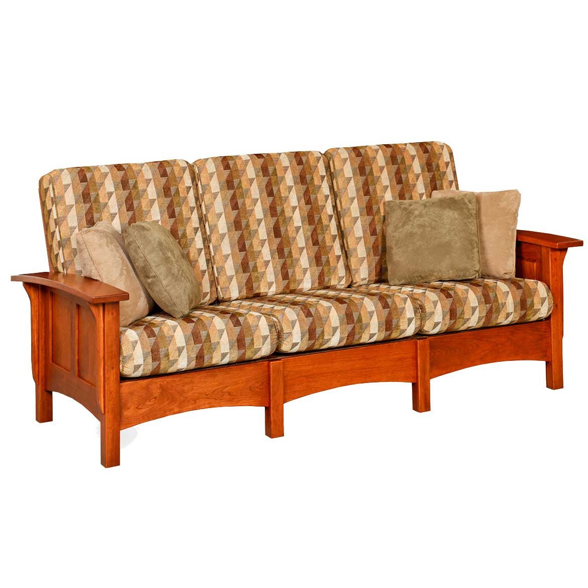 Cherry paneled Mission sofa with three geometric patterned cushions, tan pillows and an arched skirt rail