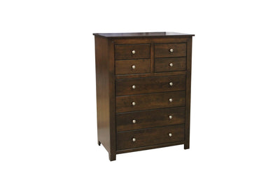 Eight drawer chest in dark brown with four small top drawers over four wide drawers and nickel knobs