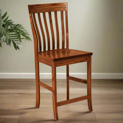 Oak counter height bar chair with a curved crest rail, five vertical back slats and a solid seat, on wood flooring