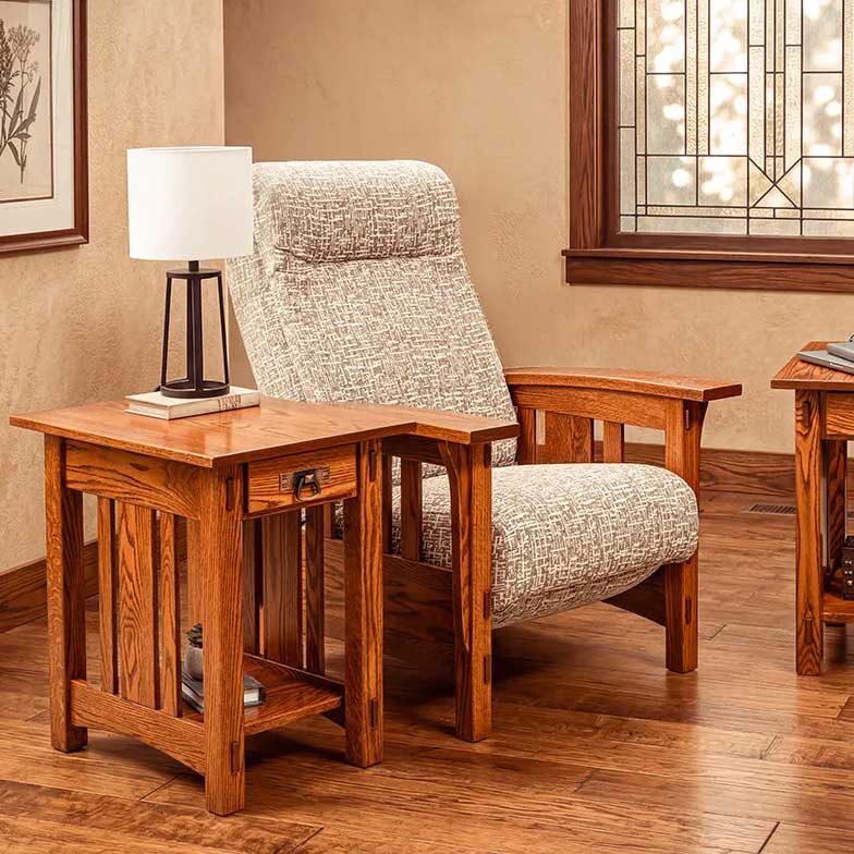 Arts and crafts oak accent recliner in tweed upholstery beside a slatted mission end table with lamp in a living room