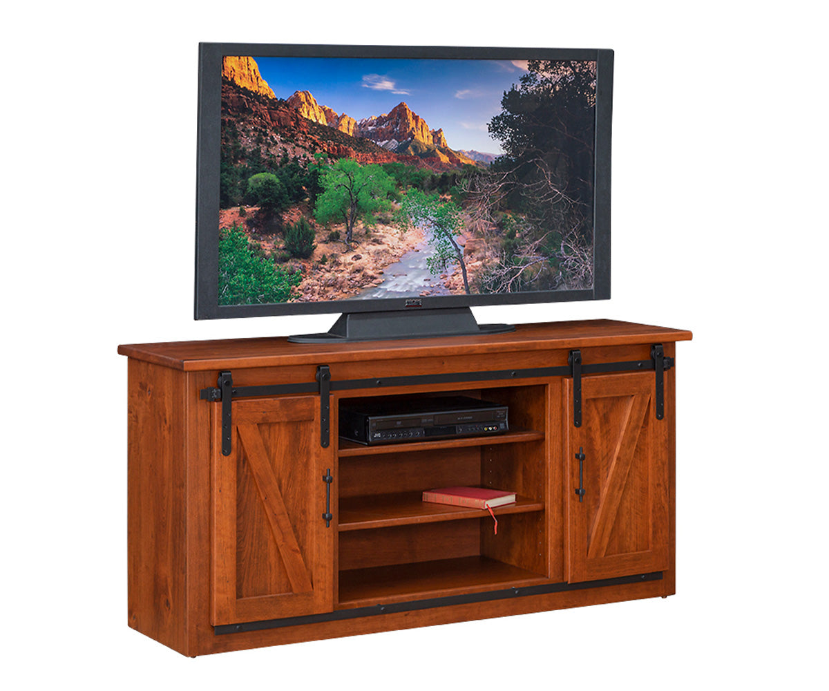 Wooden TV stand with sliding doors displaying a TV showing a nature scene.