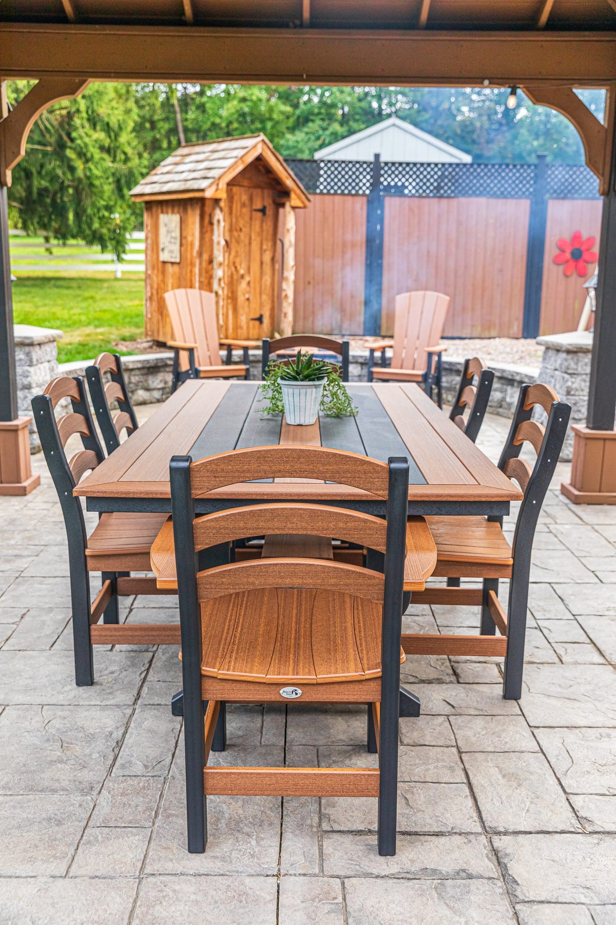 Long Beach 43 x 84 inch poly dining table with two arm chairs and side chairs, mahogany and black (photo 8)