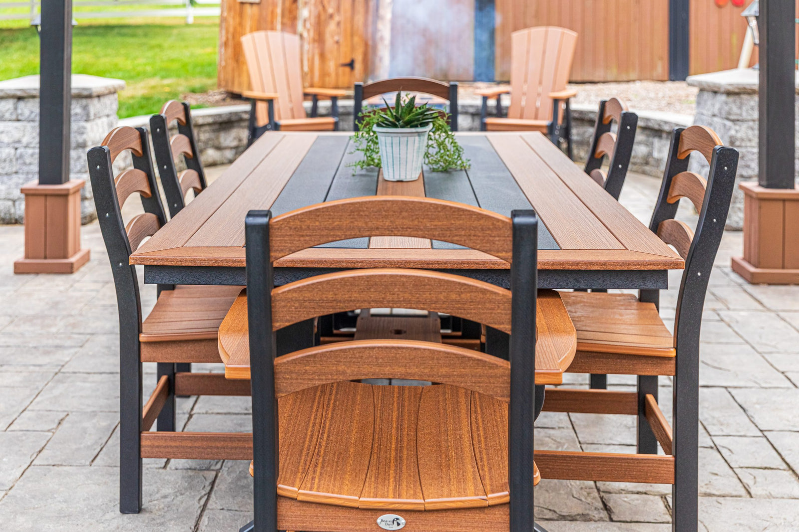 Long Beach 43 x 84 inch poly dining table with two arm chairs and side chairs, mahogany and black