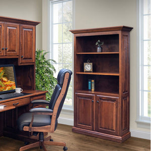 Six foot bookcase with two raised panel doors below three open shelves, next to a desk in a bright office
