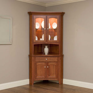 Cherry china corner hutch with two lighted glass doors, glass shelf, open display area, drawer and paneled base