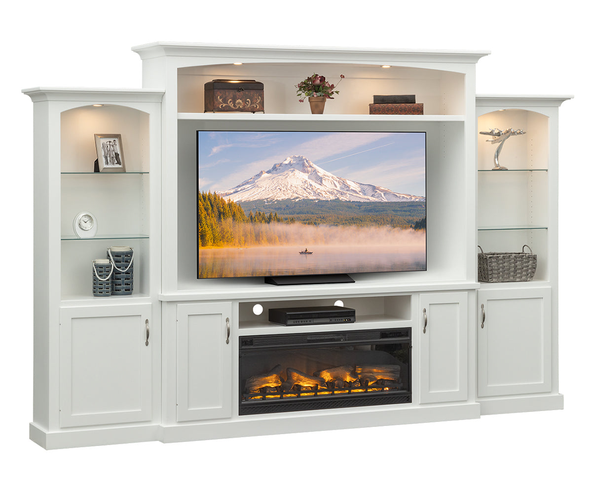 White entertainment center with TV displaying a mountain scene, surrounded by shelves and decorative items.