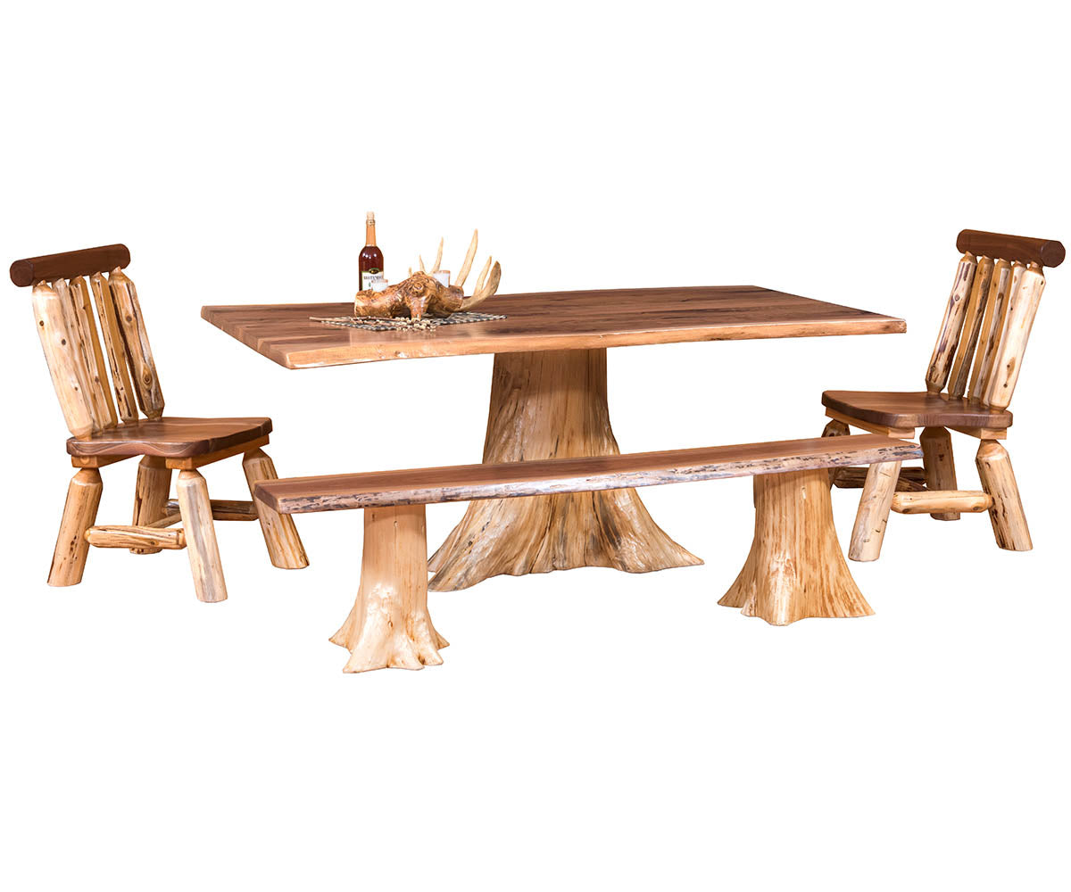A rustic log-style dining set featuring a rectangular table with a natural tree trunk base, a matching bench, and two log chairs with slatted backs, shown on a plain white background.