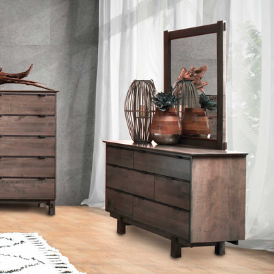 Six drawer dresser with rectangular mirror in rustic brown wood, styled beside a matching chest in a modern gray bedroom