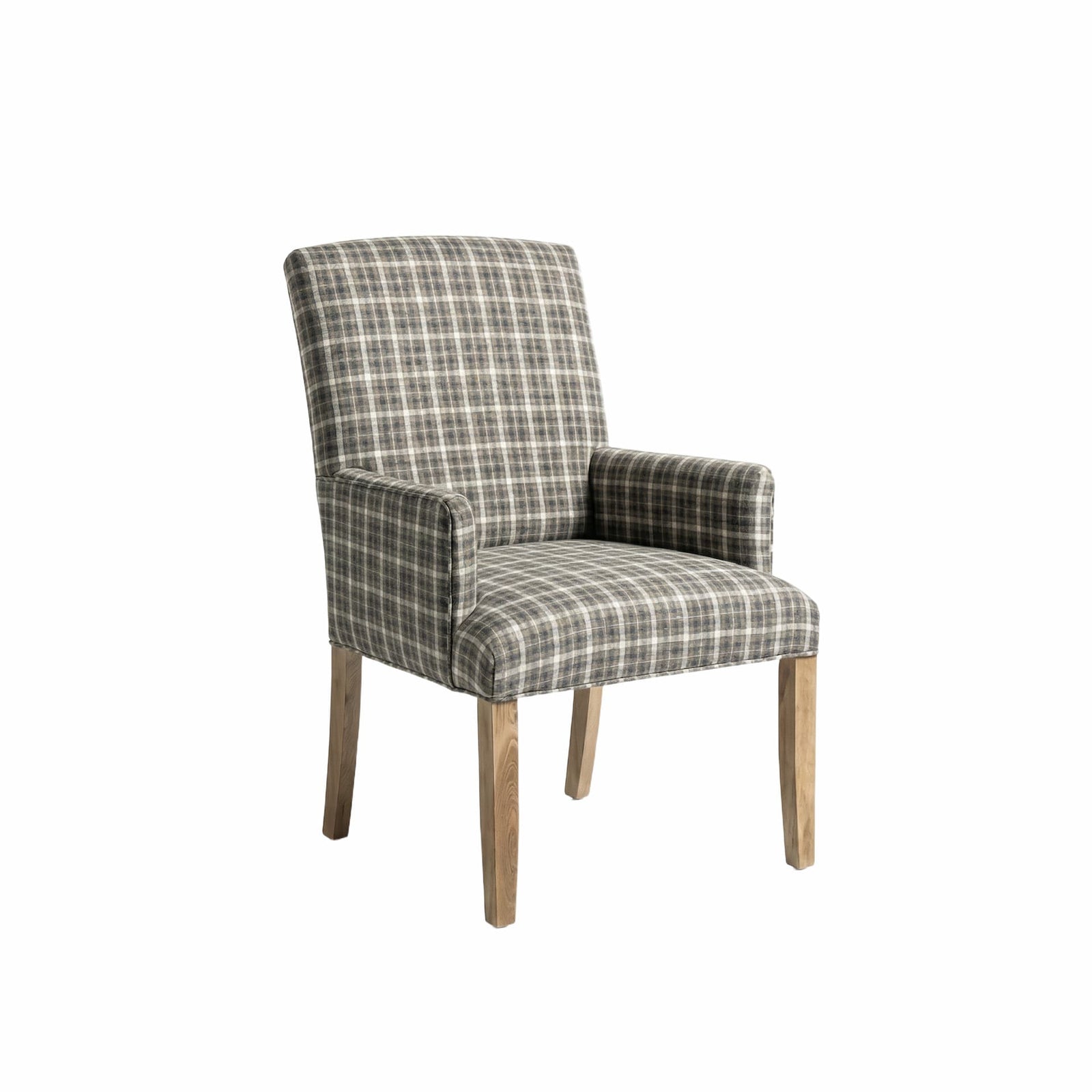 Upholstered dining arm chair in olive plaid fabric with light oak legs at a natural wood table on a wool rug