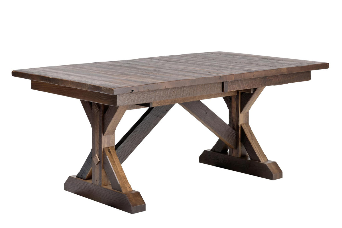 A rustic rectangular wooden dining table with a slatted top and crossed X-style trestle legs, shown on a plain white background.