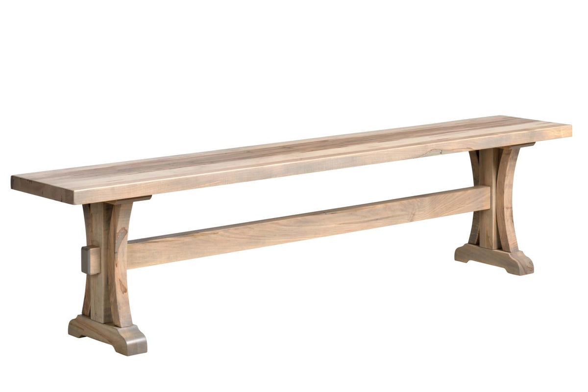 Whitewashed maple dining bench with shaped pedestal legs and a keyed stretcher, photographed on a white background