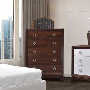 Five drawer chest in cherry with silver ring pulls styled by a window beside a white two tone nightstand