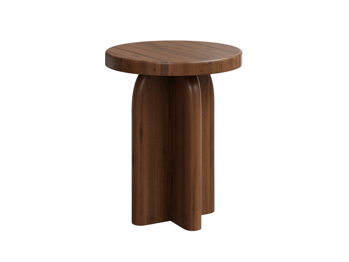 A modern round wooden side table with a curved, sculptural pedestal base, shown on a solid white background.