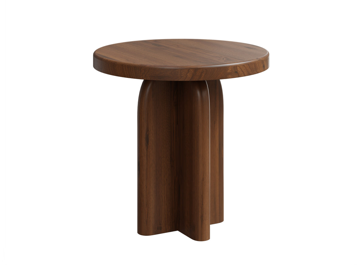 A round wooden side table with a medium brown finish and a sculptural, flared pedestal base, shown on a solid white background.
