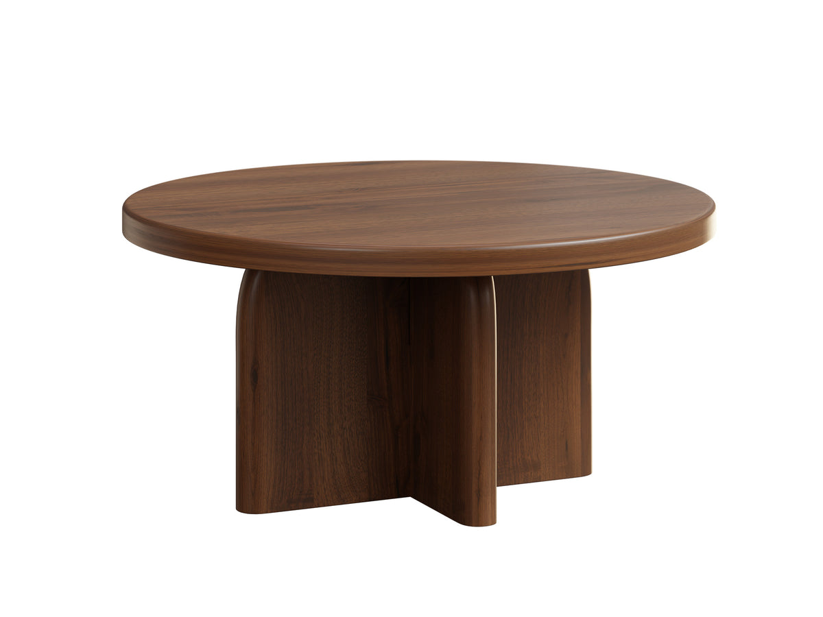 A round wooden coffee table with a dark brown walnut finish, featuring a sculptural pedestal base, shown on a solid white background.