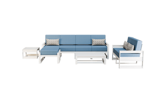 White poly patio set with blue cushions: five-seat sofa, loveseat, ottoman, coffee and side tables