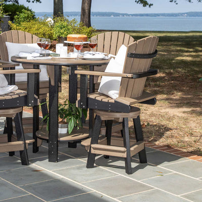 Weathered wood and black swivel Adirondack bar chairs at a round poly pub table set on a waterfront patio