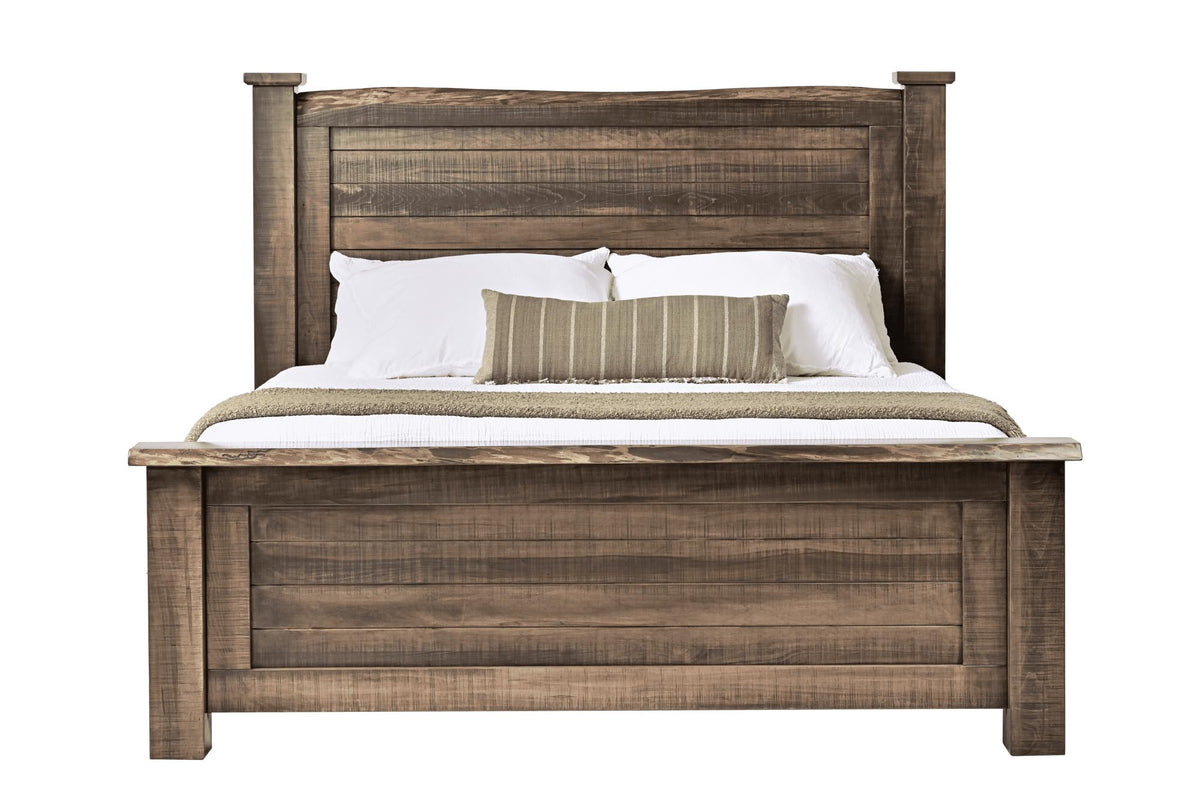 A rustic brown wooden bed frame with a slatted headboard and footboard, shown fully made with white bedding and two accent pillows against a plain white background.