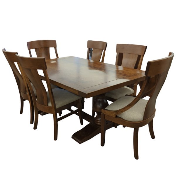 Warm brown pedestal dining table with six curved back chairs with light upholstered seats on a white background