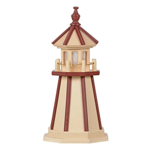 Tan poly garden lighthouse with cherry red vertical stripes, red roofed lantern room and gold chain railing